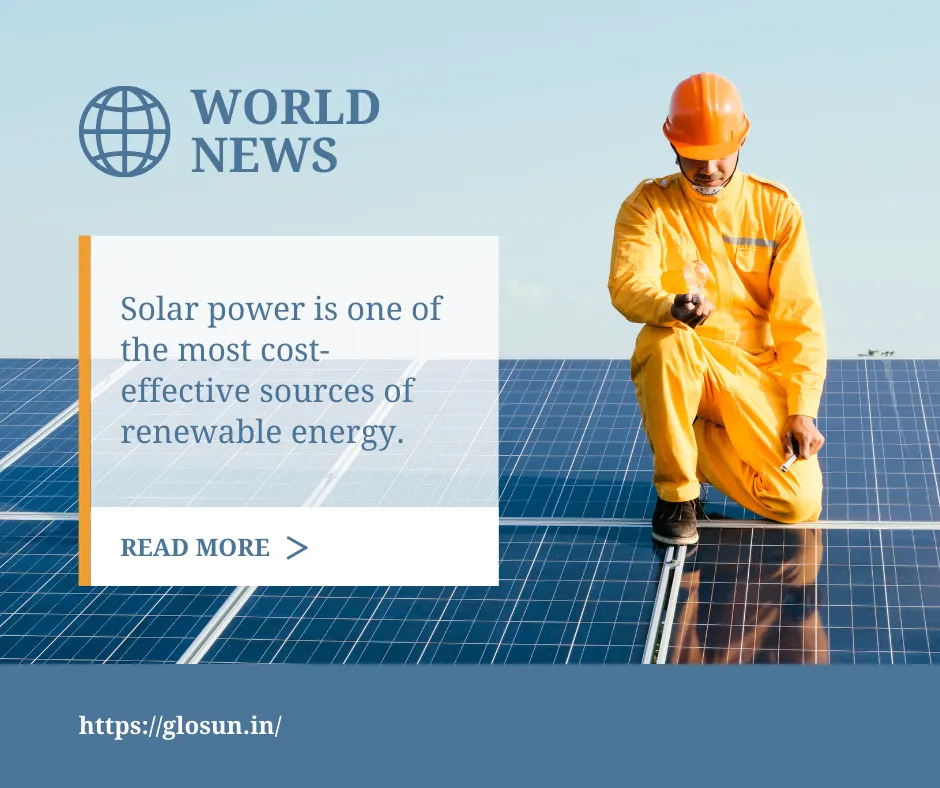 A worker in an orange safety suit and helmet installs solar panels under clear skies, promoting solar power as a cost-effective renewable energy source.